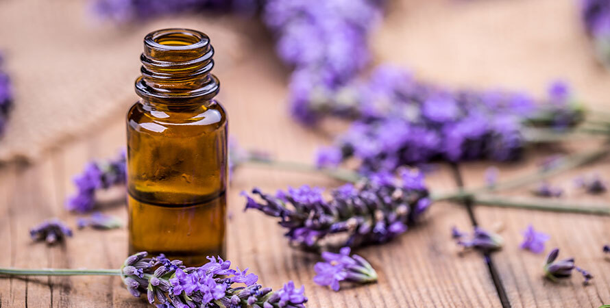 Herbal Oil Lavender Flowers On Wooden